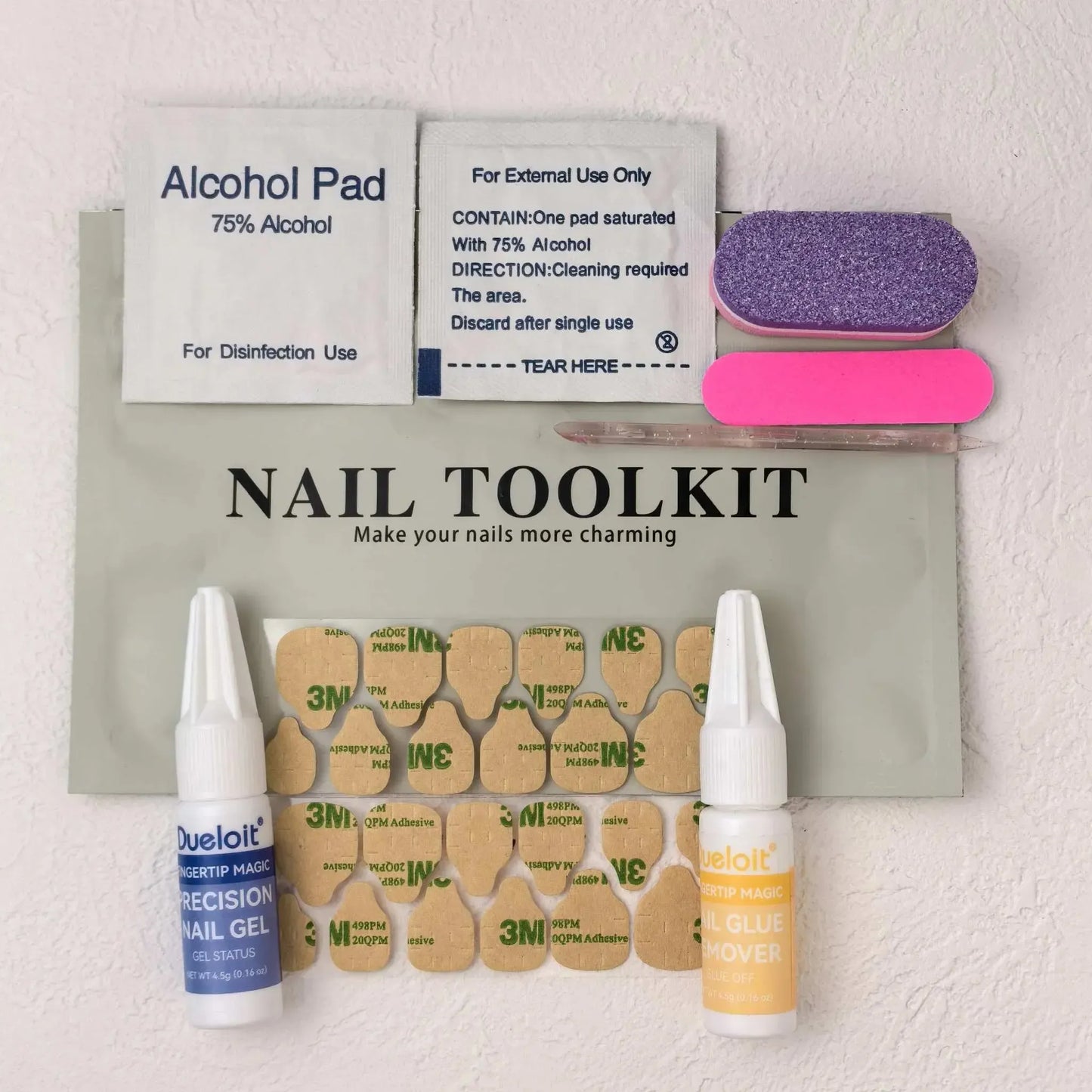 Nail prep kit with glue, tabs, remover, file, and alcohol pads