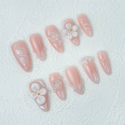 Elegant 3D floral pink press-on nails, top view, scattered layout